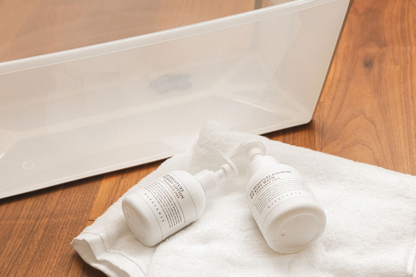 Bath amenity bottles on a folded towel