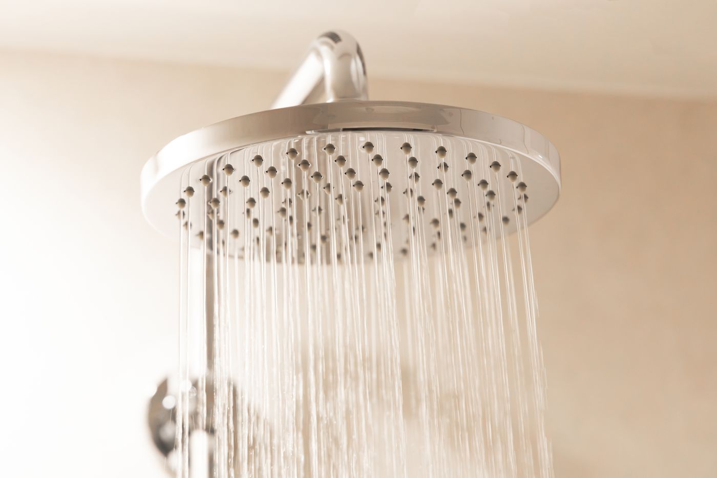A rain shower head, water falling