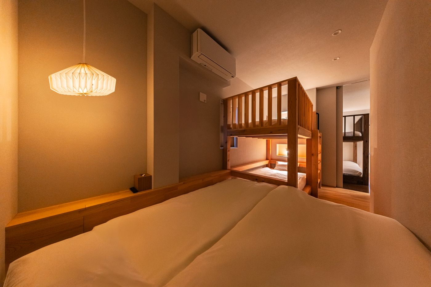 Bedroom two: a pendant lamp above the bed