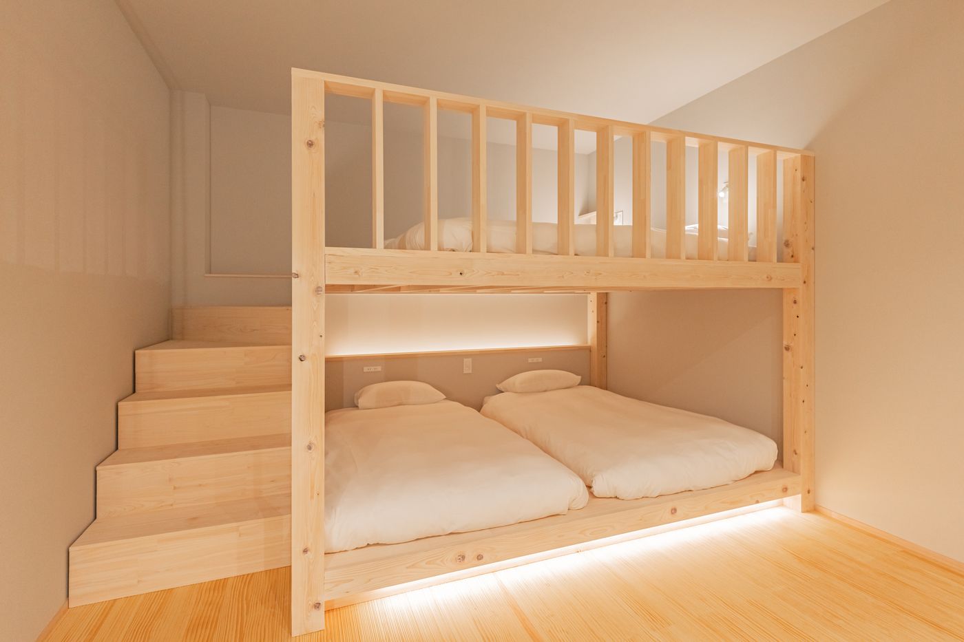Bedroom three: a timber bunk bed with built-in stairs