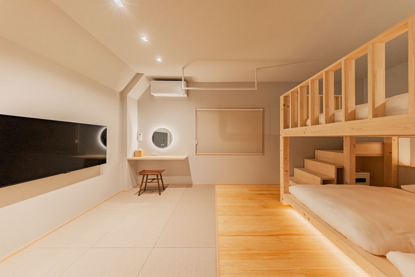 Bedroom three: a tatami room with a bunk bed and a round mirror