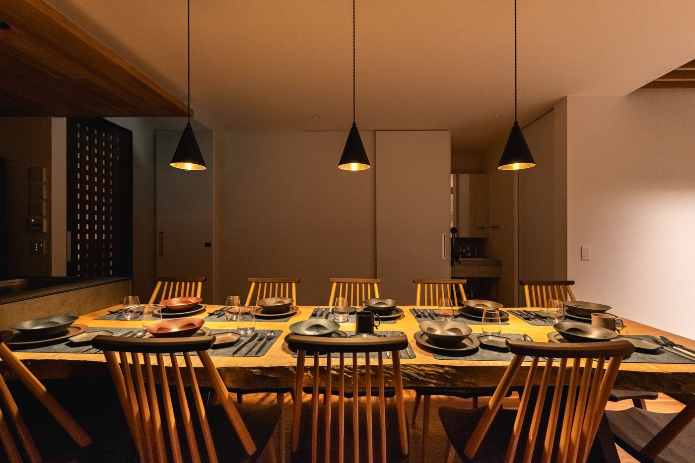 The dining room seen past a wooden lattice screen