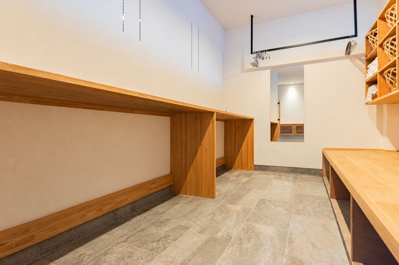 The trunk room: the long wooden counter and bench with a mirror at the far end